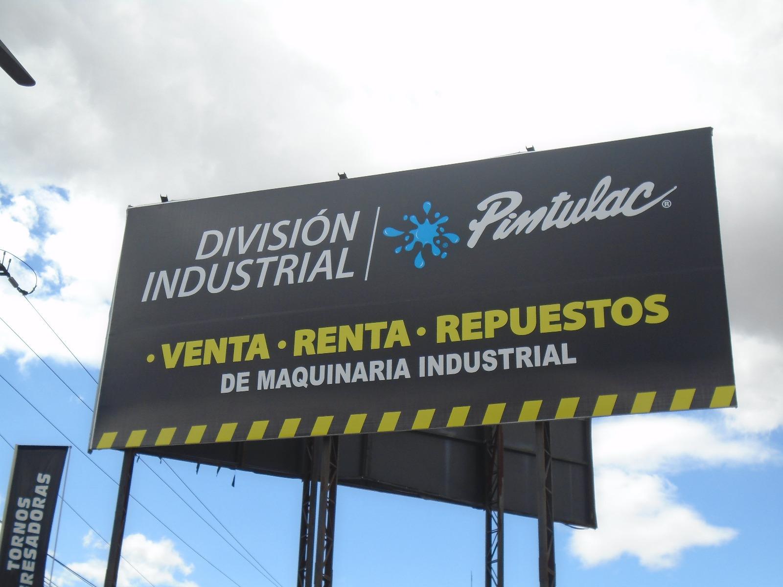 Valla negra de Pintulac División Industrial: venta, renta y repuestos de maquinaria industrial